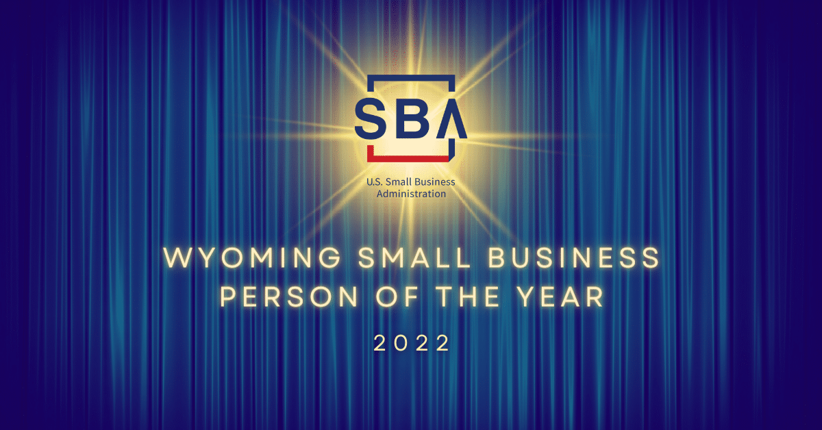 U.S. Small Business Administration logo on a blue curtain background. Text reads Wyoming SMall Business Person of the Year 2022